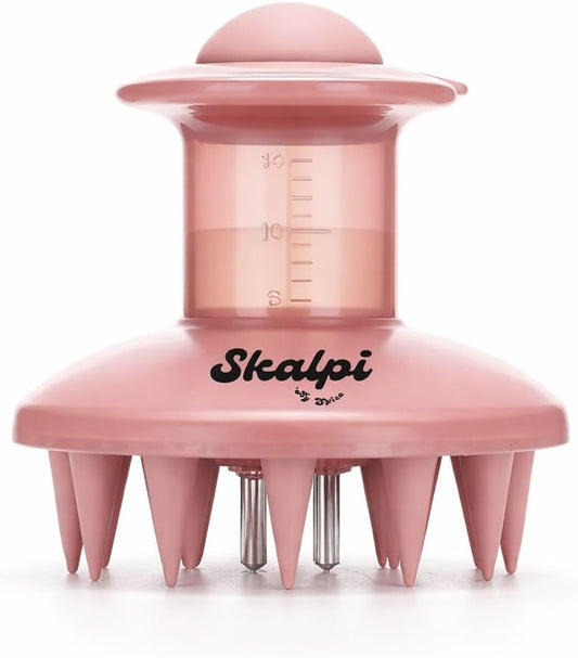 Front view of the pink Skalpi scalp applicator with the graduated reservoir markings and two dispensing tips between the bristles